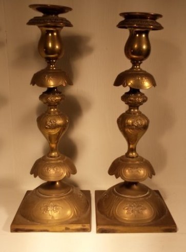 POLISH 1800'S BRASS CANDELSTICKS" NORBLINIS WARSZAWA": Polish brass candle sticks. Markings on bottom "1139 A", "W", "NORBLINIS WARSZAWA GALW". Stands 13" tall, base is 4 3/4" wide. TOTAL WEIGHT: 995 GRAMS