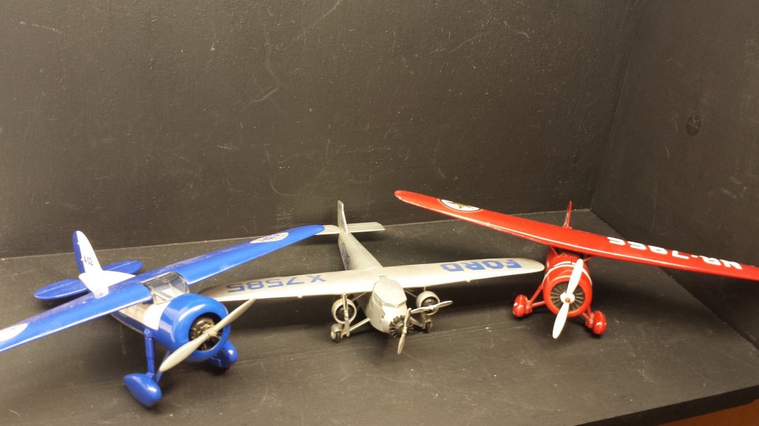 3 CAST IRON MODAL AIR PLANES: These are great collector's air planes. Texaco cast iron coin bank copywrite '93. The ford motor company copywrite '95, and the Amoco plane is copywrite '92. These planes came out of a collector's hom