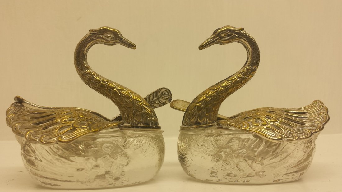 ANTIQUE SWAN SALT@PEPPER SERVERS: These are a set of antique crystal and silver swan salt @ pepper serving dishes. They do have the spoons to each one of them. The wings of the swans open up and that's where dish is filled and spoon i
