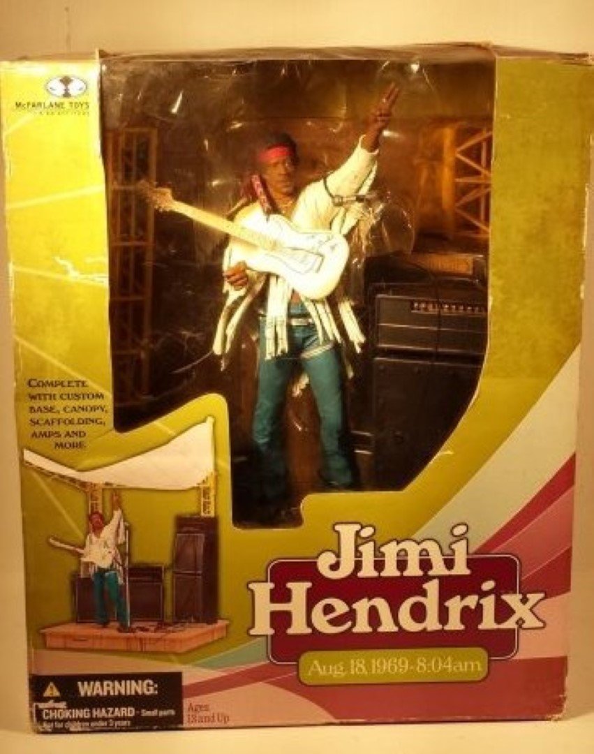 JIMI HENDRIX COLLECTIBLE TOY: This Jimi Hendrix Toy comes complete w/ custom base, canopy, scaffolding, amps and more. It's a McFarlane Toys product from "2003". Depicts him playing on August 18,1969-8:04am. Box is 11in.H X 9in.W.