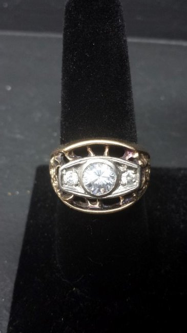 MENS CZ 14K SOLID YELLOW GOLD RING: SOLID 14K YELLOW GOLD 11.5GRAMS.This is a mans 14K Yellow Solid Gold ring. It has CZ stones in center. 1 lg and 2 small ones on each side.TOTAL WEIGHT:12.0GRAMS