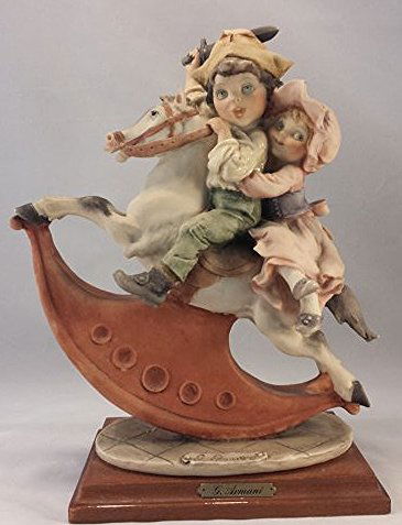 CAPODIMONTE PORCELAIN FIGURINE SIGNED G. ARMANI: Giuseppe Armani porcelain figurine. Boy and girl on rocking horse.