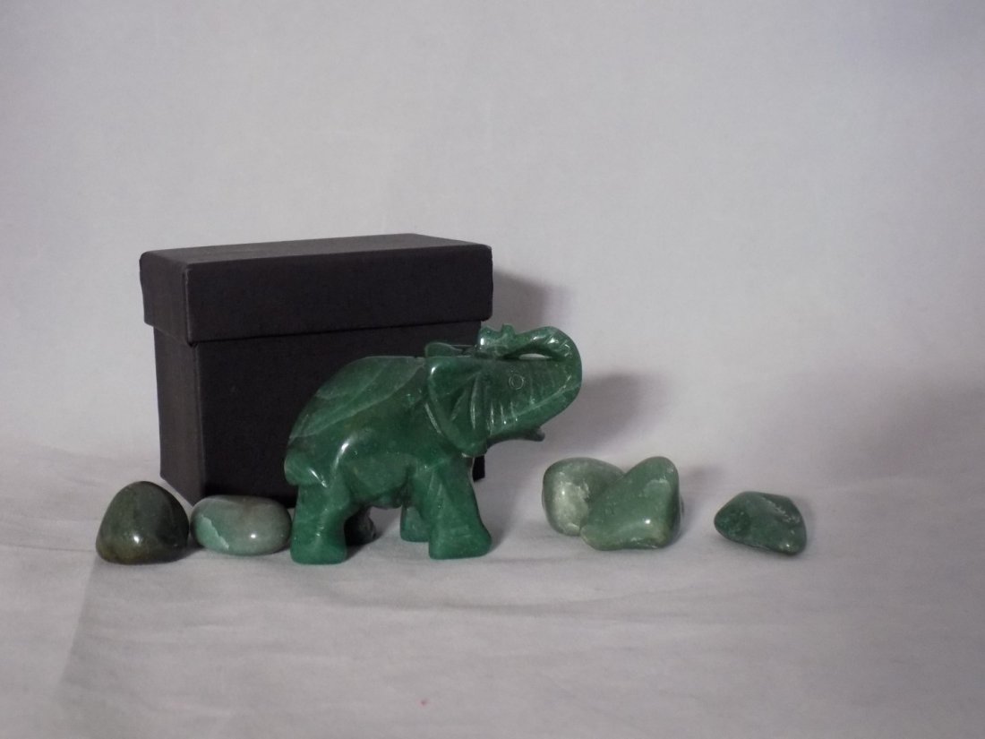 HAND-CARVED JADE ELEPHANT & 5 POLISHED JADE STONES SET: This lot comes with a Hand-carved Jade Elephant that is 2.5in.t. X 3in.L. It also contains 5 polished Jade stones.4 average 1.25in. & 1- 1.5in.
