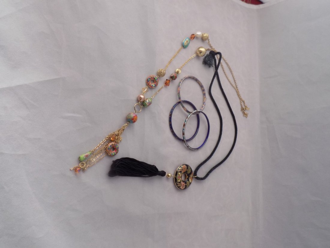 VINTAGE CLOISONNE SET 2)NECKLACES & 3)BANGLE BRACELETS: This is a Vintage Lot of Cloisonné Jewelry. This lot has:1 19in.L hand-made black rope necklace with a round black and hand-painted flowers and butterfly w/ a hanging tassel. It has Gold-tone accents