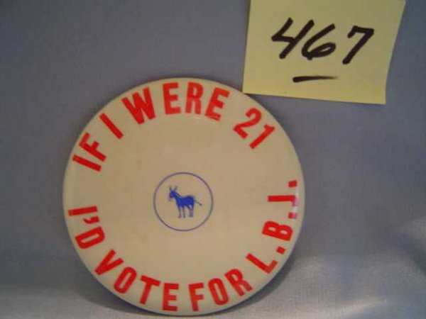 "LBJ" Campaign Button - 1964: White campaign button with blue Demoratic donkey and red lettering saying "If I were 21 I'd vote for L.B.J.". On the rim is printed, "Fargo Rubber Stamp Words, Fargo, N.D.". Pin on back is intact; min