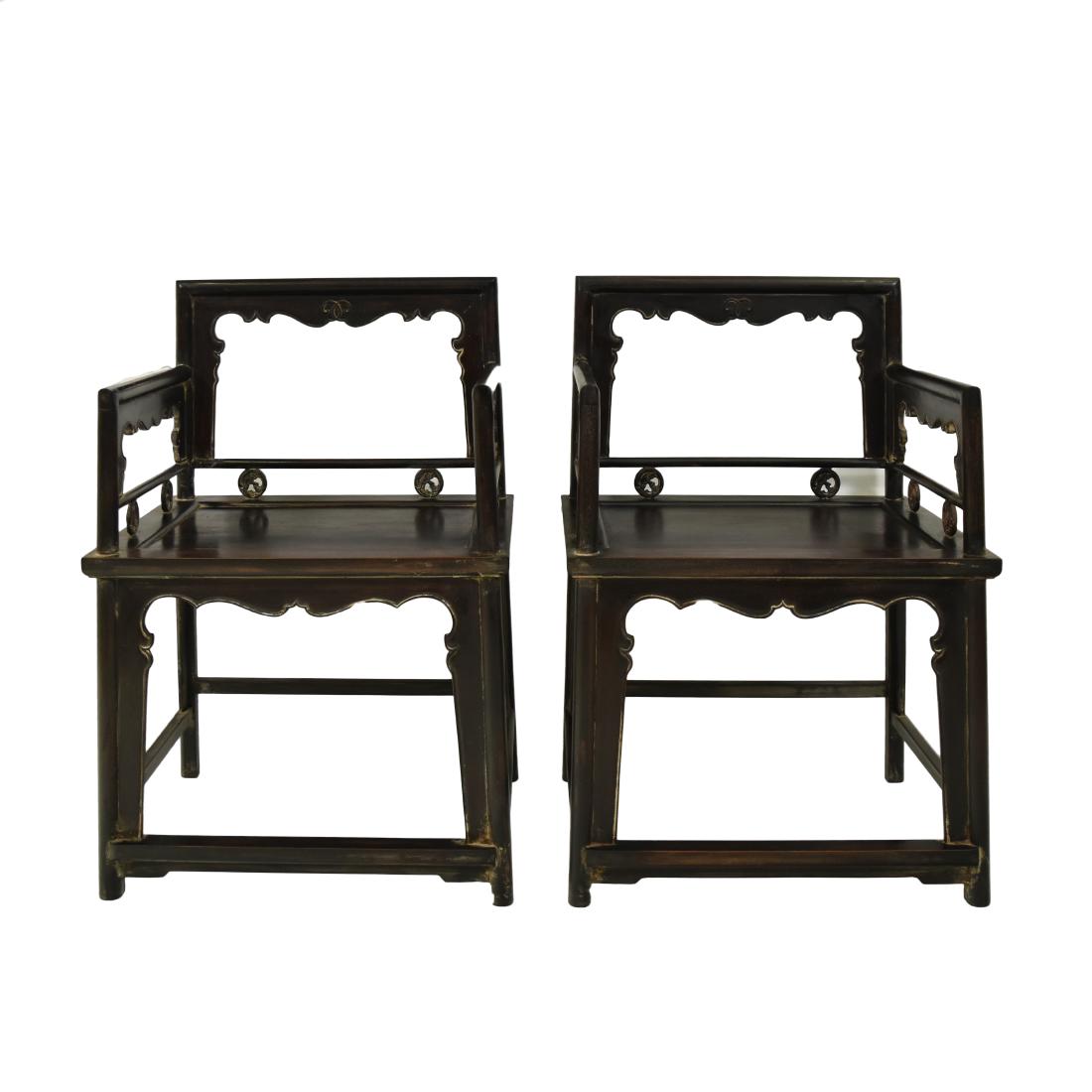 PAIR OF CARVED ZITAN ROSE CHAIRS, MEIGUI YI: Each with an open-carved back frame formed by a straight top rail rounding the corners to the back posts, set with an inset beaded border apron and spandrels, the straight arms continuing down to form