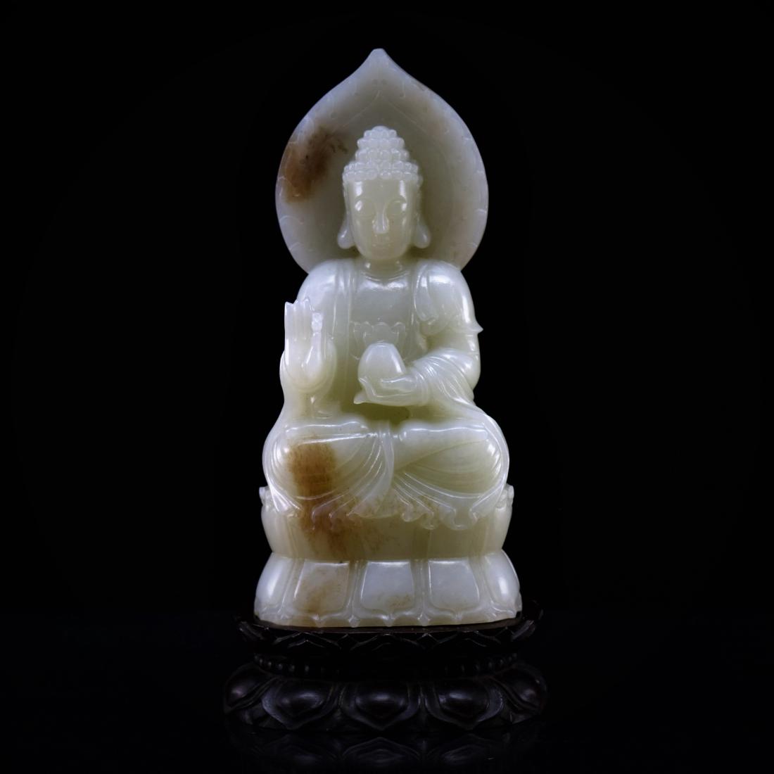 A CARVED CHINESE JADE BUDDHA ON STAND (1 of 9)