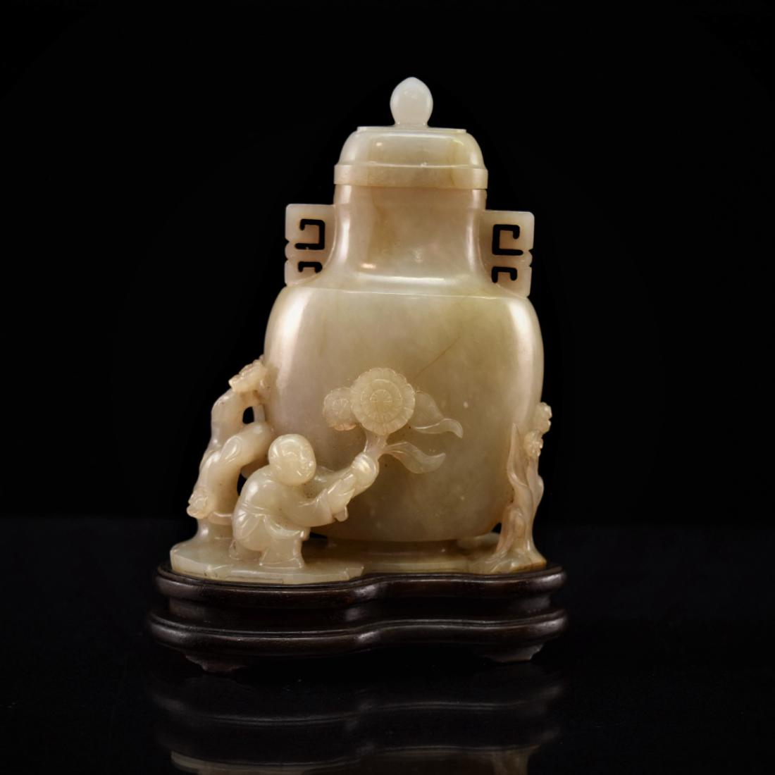 CARVED JADE BOYS PLAYING NEXT TO JAR (1 of 9)