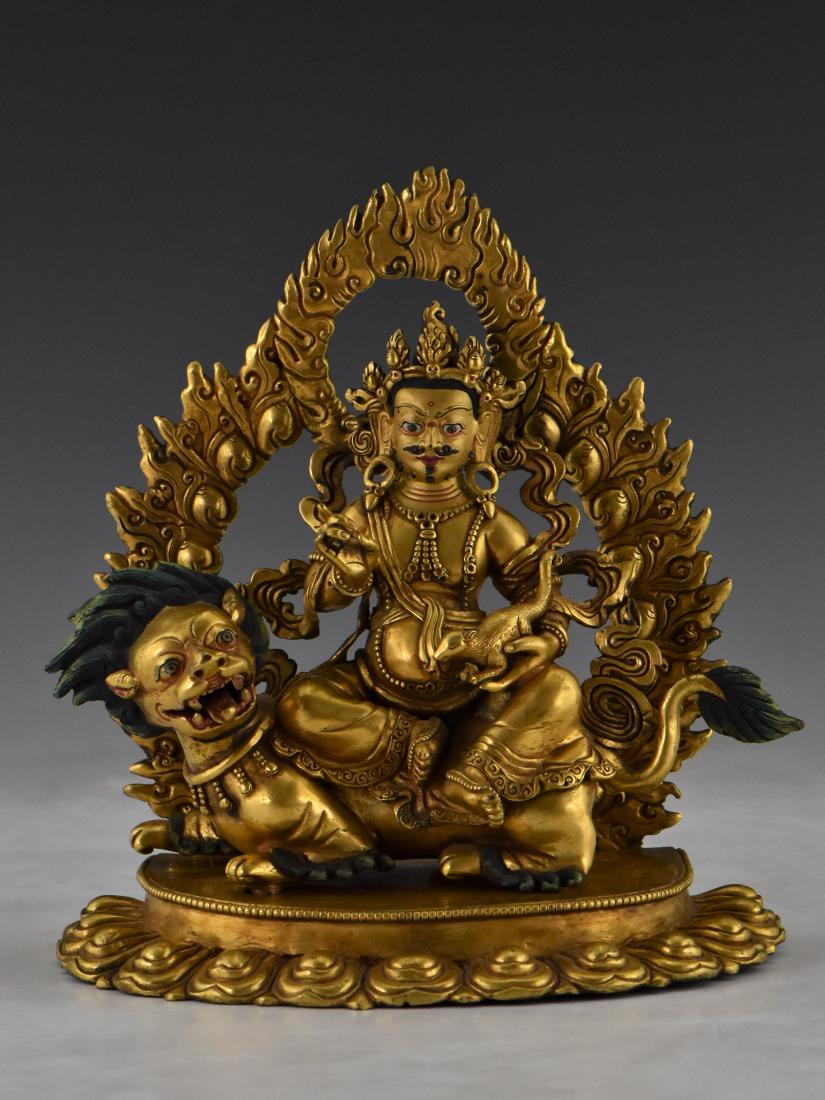 GILT BRONZE BUDDHA FIGURE OF VAISHRAVANA RIDING A LION (1 of 11)
