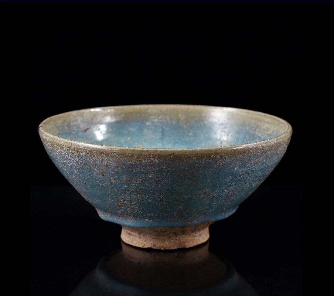 CHINESE YUAN DYNASTY CELADON BOWL: Very fine Chinese Yuan Dynasty porcelain potted in a low bowl form, with narrow cavetto, rising steep sides toward the flat wide opening, raised upon slightly concaved and narrow foot base. Covered ov