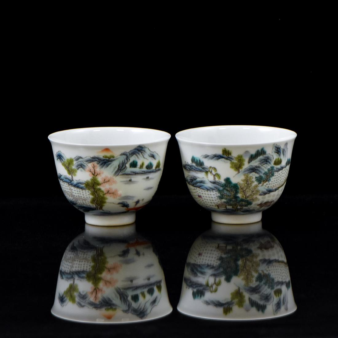 PAIR OF CHINESE QING LANDSCAPE WINE CUPS: Pair Chinese porcelain wine cups finely potted with inverted bell shape form. The round cavetto everted steep sides leading to slightly flaring rim, and raised upon a footed base. The exterior decorat