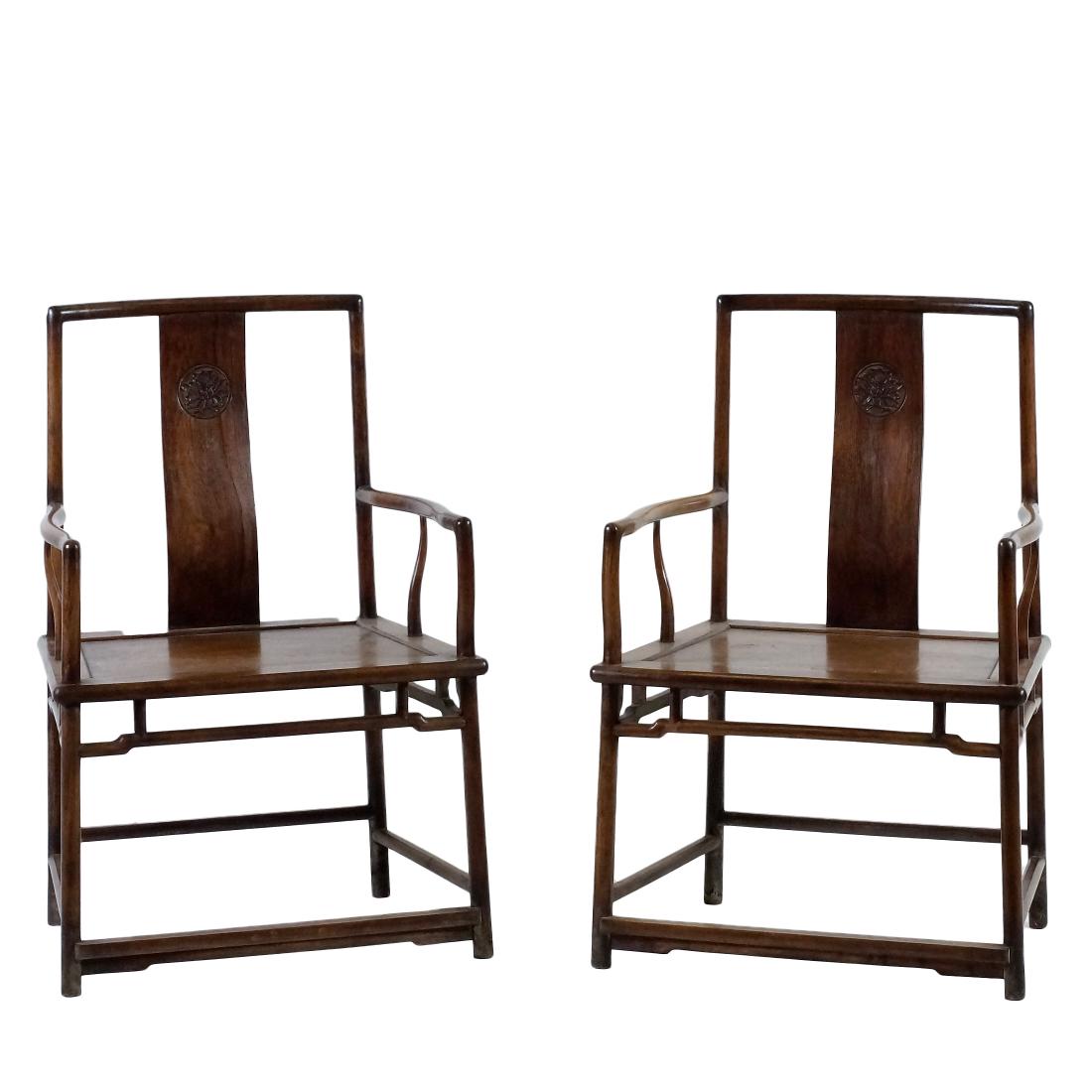 PAIR OF HUANGHUALI SOUTHERN OFFICIAL'S HAT ARMCHAIRS: PAIR of HuangHuaLi Southern Official's Hat. Each beautifully proportioned with narrow crest rail supported on slender, gracefully tapered and curved rear posts. S-shaped splat, above the hard mat seat