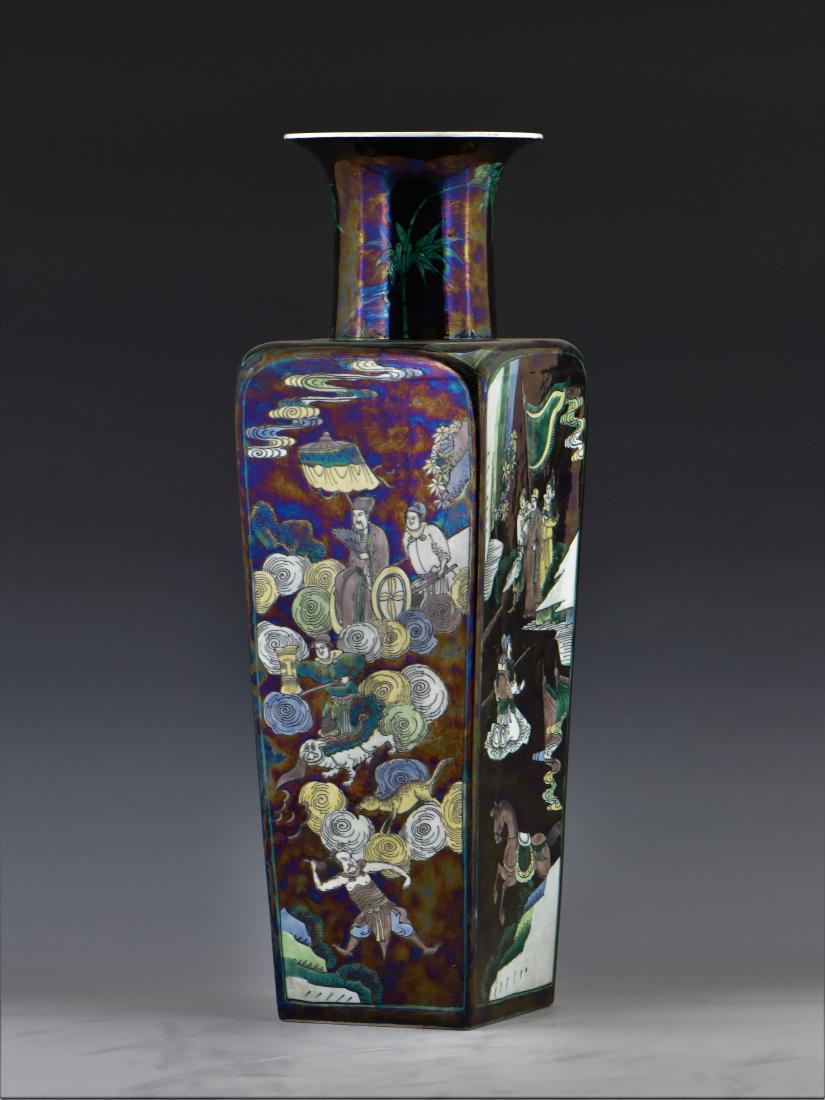 CHINESE KANGXI FAMILLE NOIR SQUARE VASE: Chinese KangXi Famille noir with squared baluster body, flat shoulder gently everted the cylindrical straight neck toward flaring rim, raised upon a square and slightly concave flat base. The exterior