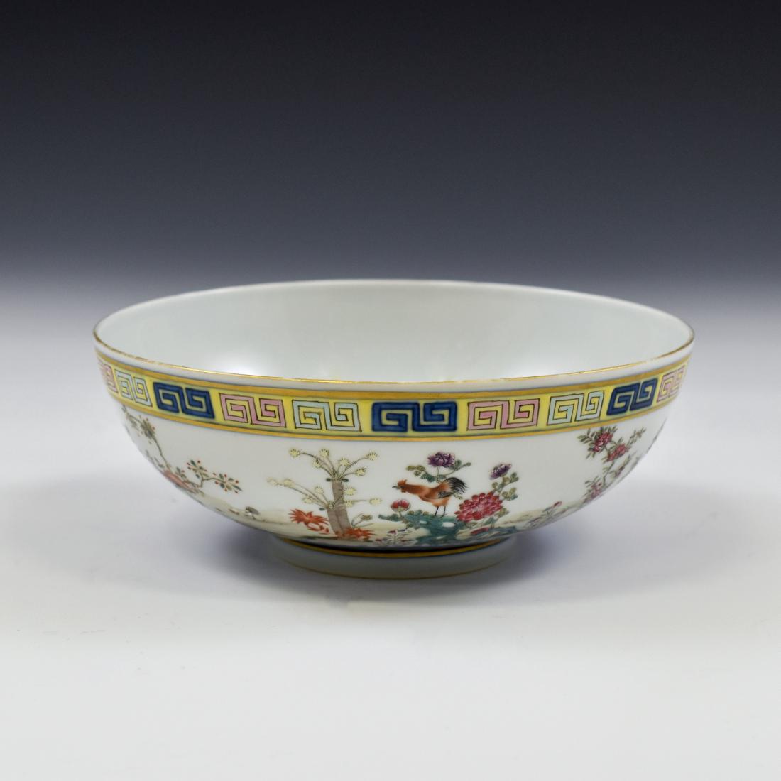 CHINESE FAMILLE ROSE CAMELIA MOTIF BOWL: Finely potted Chinese porcelain bowl in deep vessel form, with rounded cavetto gracefully rising a steep sides toward wide gallery mouth, raised upon a ring footed base. The exterior decorated with de