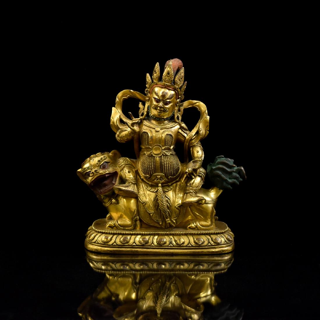 RIDING LION VAISHRAVANA GILT BRONZE BUDDHA STATUE: 19th Century Qing Dynasty Chinese Tibetan gilt bronze Bodhisattva Buddha figure of Vaishravana Riding a Lion, also known as Vaishravana. The chief among the protectors of the Teaching, Buddhist guardi