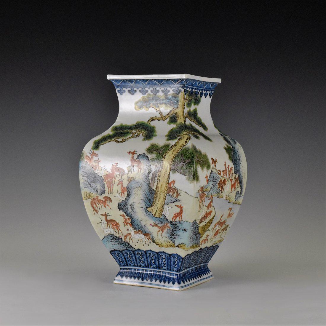 HUNDRED DEERS CHINESE PORCELAIN SQUARE BALUSTER VASE: Of squared baluster shape, wider shoulder terminating the waisted prominent neck supported the flaring square rim, gently tapered on the lower body, raised on slightly flaring foot base. Decorated aro