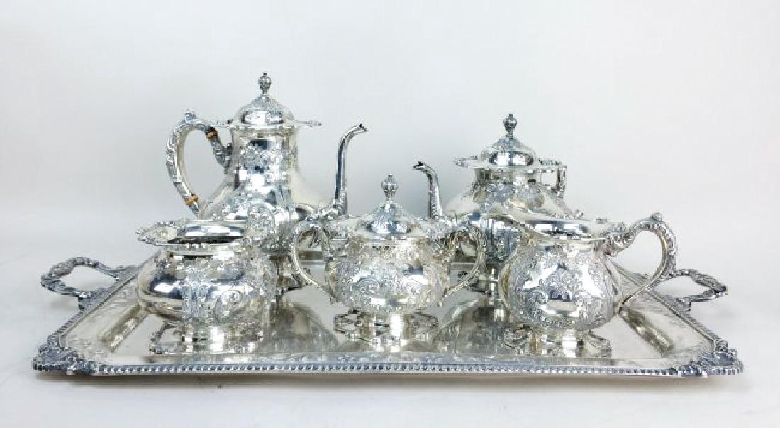 SET OF 6 PCS FRANK WHITING SILVER TEA SET, 266.69 TROY: American sterling silver coffee and tea service, Frank. M. Whiting and Co., North Attleboro, Massachusetts, (set of 6) hand chased with scrolling foliage and flowers, comprising: (1) coffee pot, 10.25