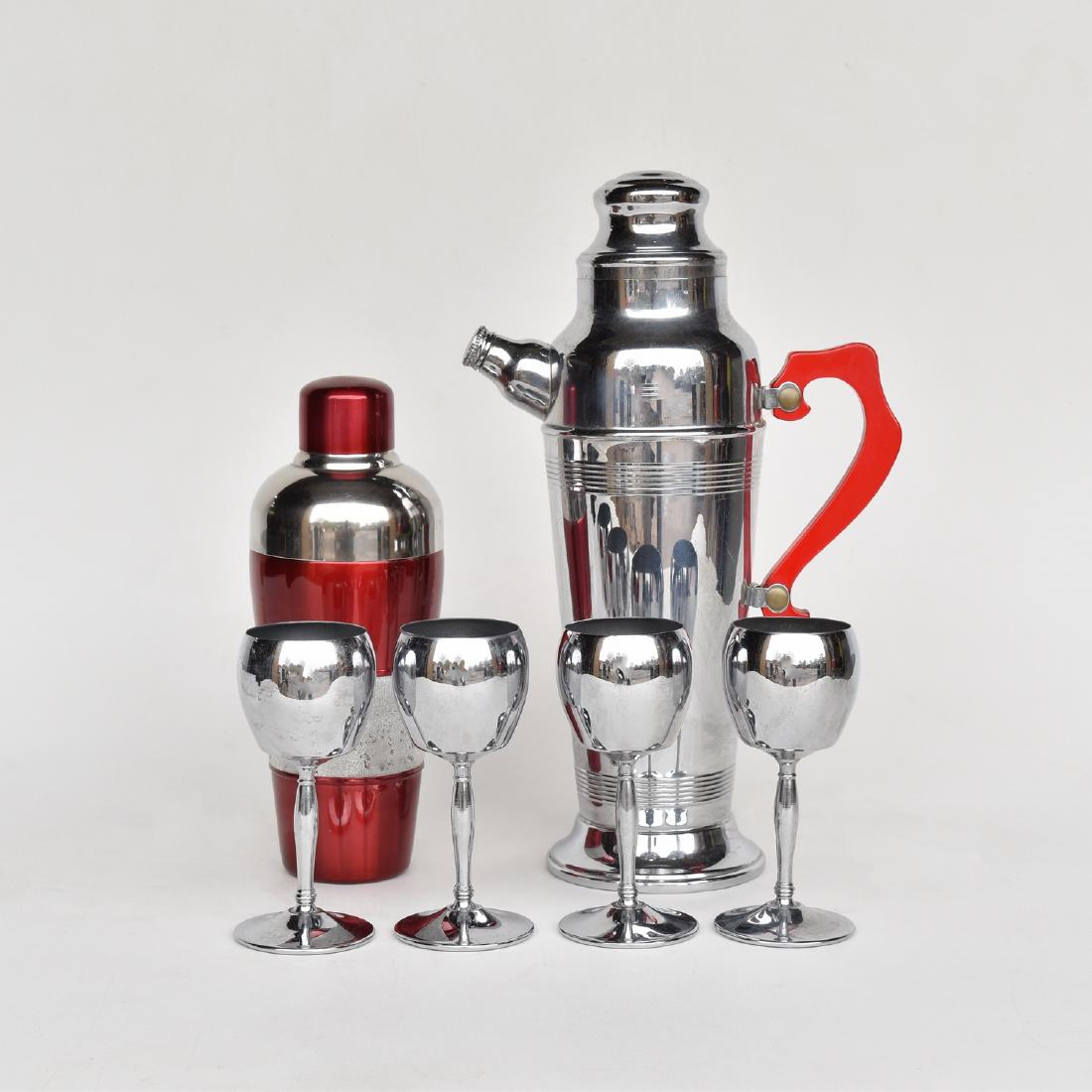 CHROME & RED LUCITE COCKTAIL SHAKER SETS: Rare Bakelite stainless steel art deco bar set with red handle bar: includes decanter and 4 wine cups, and red and stainless steel shaker, decanter is 13"H, wine cups are 5.25"H