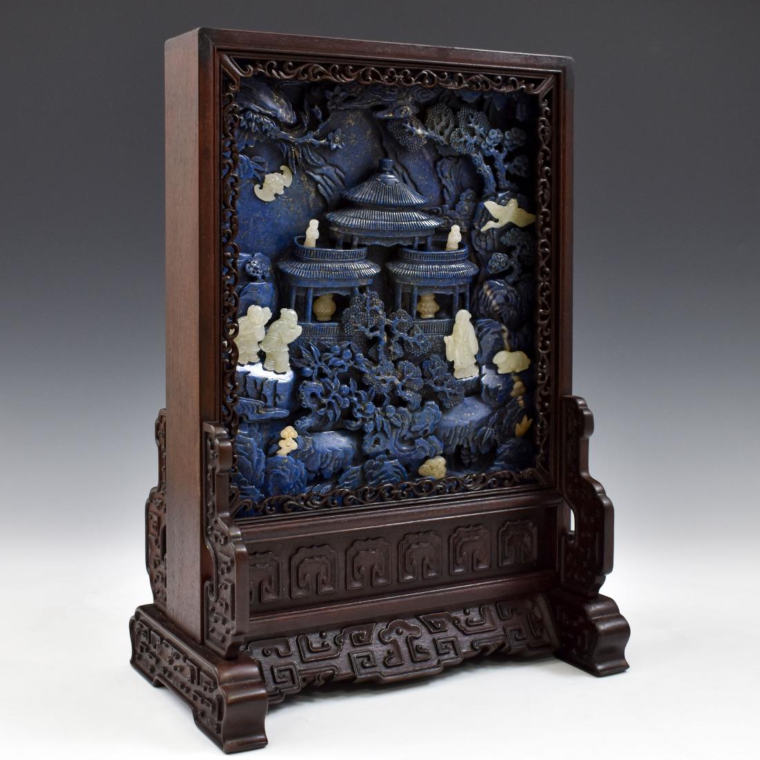 LAPIS LAZULI TABLE & JADE PANORAMIC TABLE SCREEN: A stunning Lapis Lazuli rectangular table screen with inlaid jade stone. Depicted is a central pagoda surrounded by various animals and Daoist scholars. The Fu-bat, crane, and water buffalo can be fou