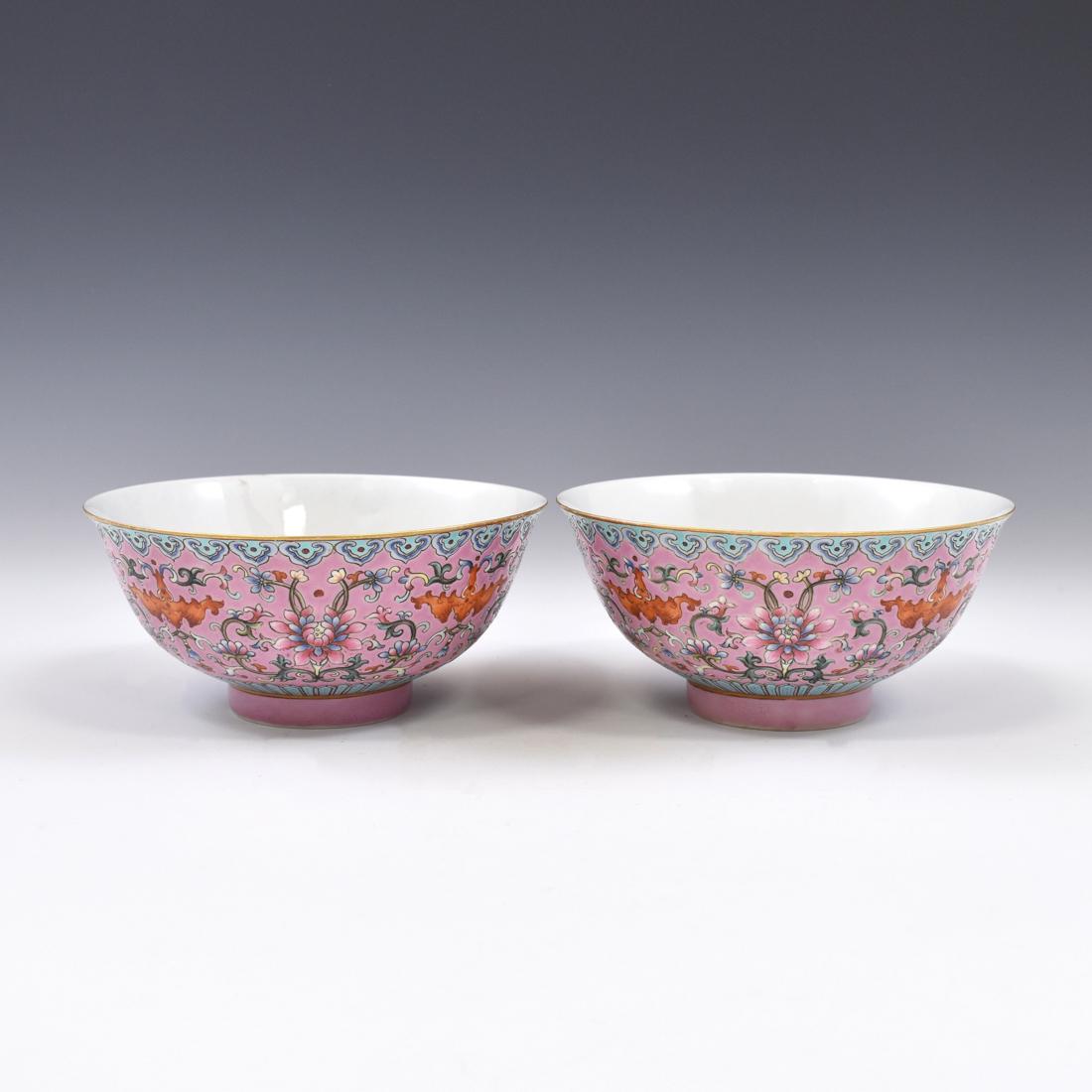 PAIR QIANLONG FAMILLE ROSE PORCELAIN BOWLS: Finely potted Chinese porcelain in a deep vessel, with rounded cavetto rising a steep sides toward slightly flared rim, upon a gilt ring footed base. The exterior decorated with colorful famille rose