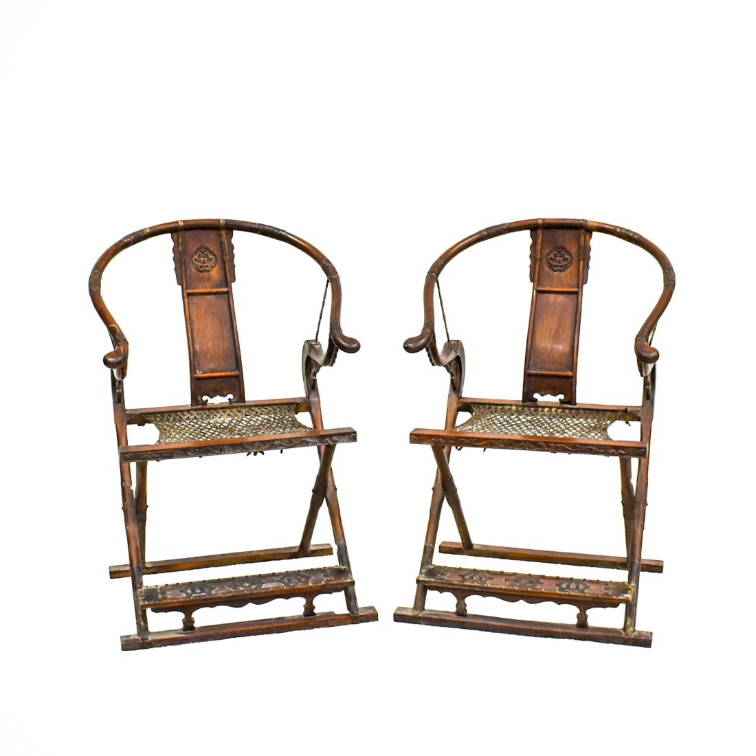 PAIR OF BRASS-MOUNTED HUANGHUALI FOLDING CHAIRS: ANTIQUE CHINESE HUANGHUALI FOLDING CHAIRS WITH WOVEN ROPE MAT, JIAOYI The round top rail continuing in a curve to the arms terminating in out swept ends, each arm supported by the hooked upper extensi