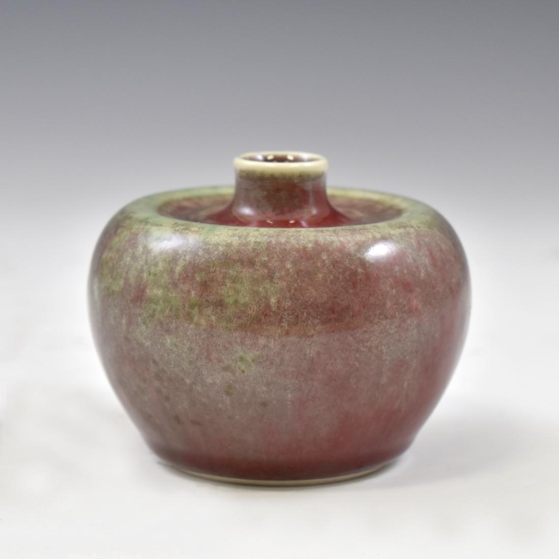 KANGXI APPLE GLAZED PORCELAIN ZUN WATER POT: Kangxi apple glazed porcelain Zun water pot. Raised upon a flat base in the shape of globular body step up in wide shoulder with tapered short neck and narrow opening in reddish green underglaze and w