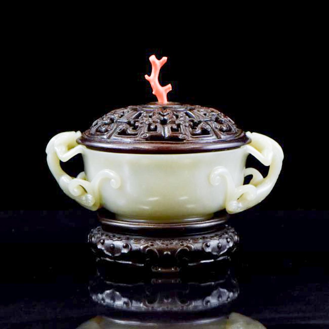 WOODEN COVERED JADE CENSER WITH RED CORAL FINIAL: Chinese celadon Nephrite jade carved into a bulbous deep vessel, gently waisted neck further to wide opening, raised on a ring foot base. Two double tailed tiger emerged on gathering mouth. The wooden