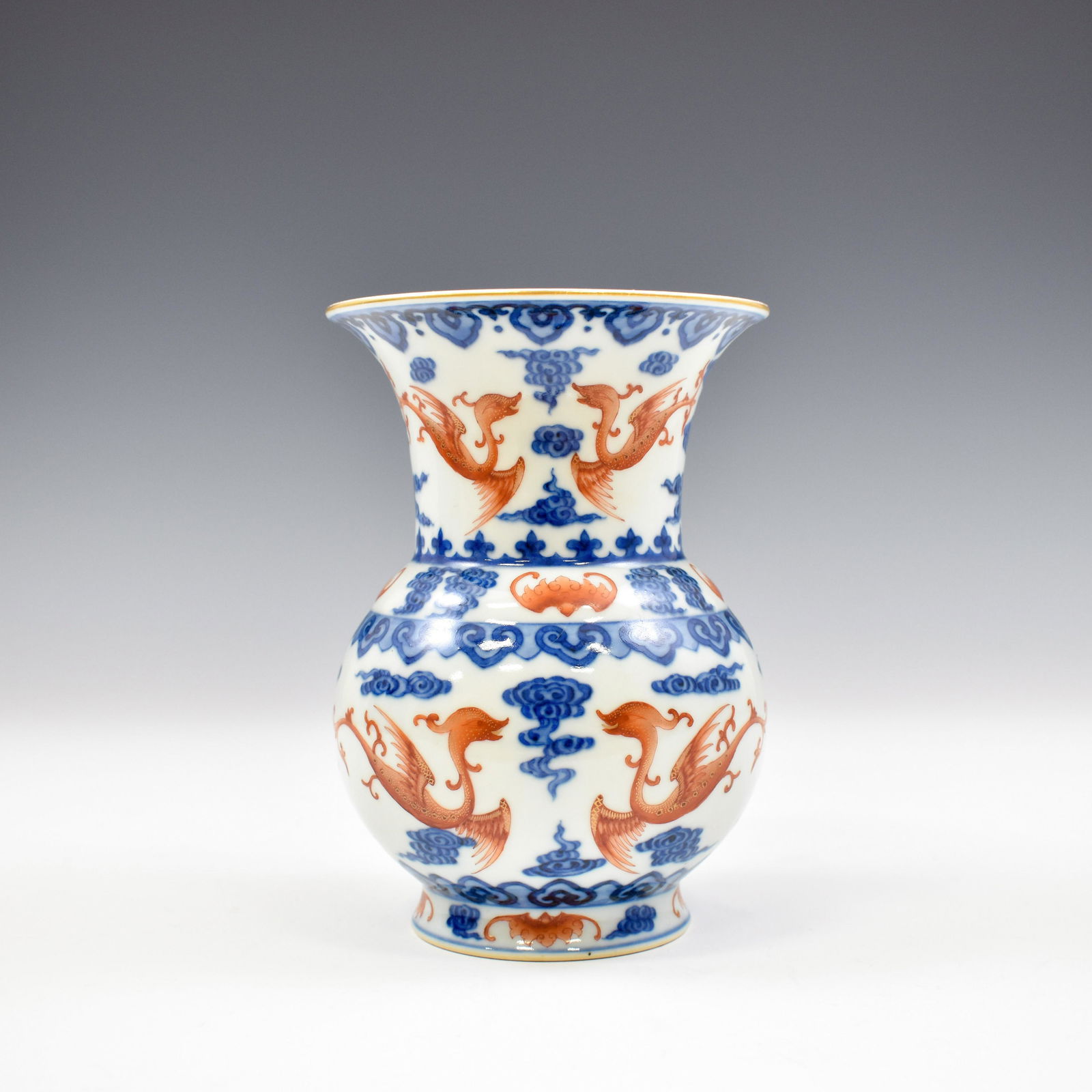 QIANLONG BLUE AND RED DRAGON ZHADOU VASE: Dimensions: 6-1/4" H x 4-5/8" Dia. Chinese Qing Dynasty porcelain Zhadou vase. Potted with a bulbous lower belly, gently waisted toward neck, flared mouth rim leading to wide opening, enclosed with th