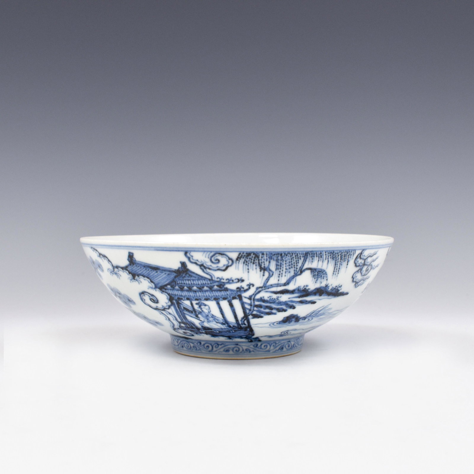 MING XUANDE BLUE AND WHITE BOWL: Dimensions: 2-3/4" H x 7-3/4" Dia. Chinese Ming Dynasty Period, Xuande blue and white porcelain bowl. The porcelain potted with a shallow body, of a shallow vessel, broad wide cavetto, with a straight