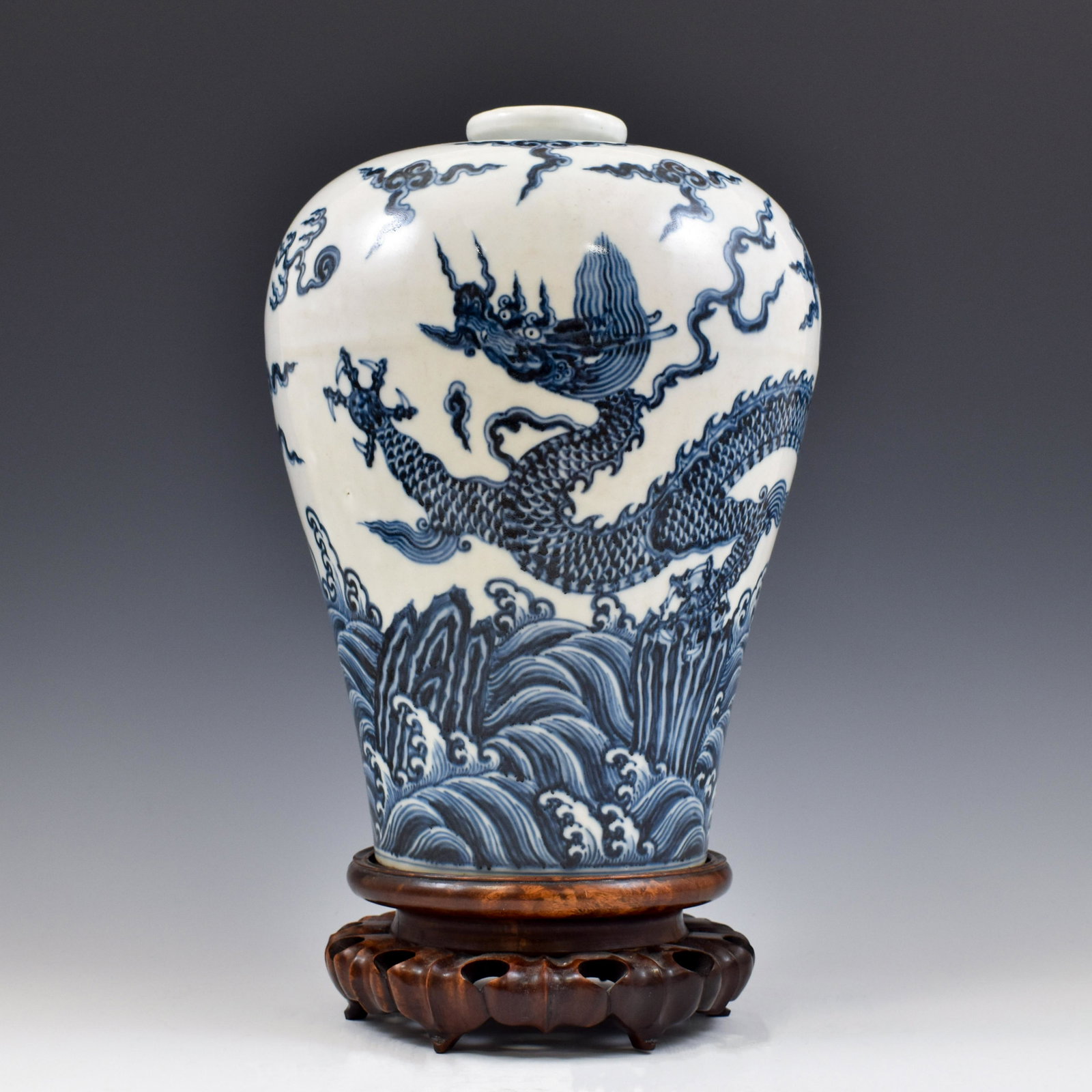 XUANDE BLUE AND WHITE DRAGON MEIPING VASE: Dimensions: 13-3/4" H x 10-1/4" Dia. Stand: 3" H Chinese Ming Dynasty Period Xuande blue and white dragon Meiping vase. The porcelain shaped into a traditional Meiping form, thick potted, with a narro