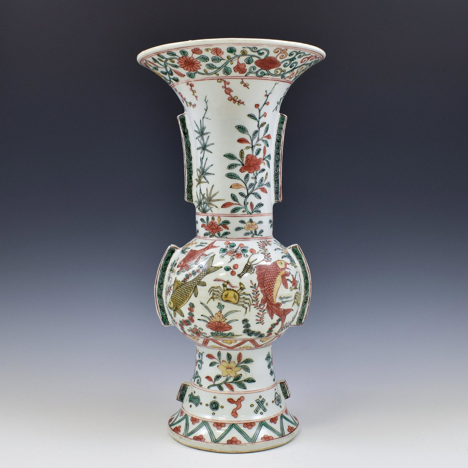 MING WANLI WUCAI GU BEAKER VASE: Chinese Ming Dynasty Period, Wanli wucai gu beaker motif porcelain vase. The vase potted in a Chinese porcelain traditional Gu beaker shape, having baluster shaped body, large, tall and thick, bulging
