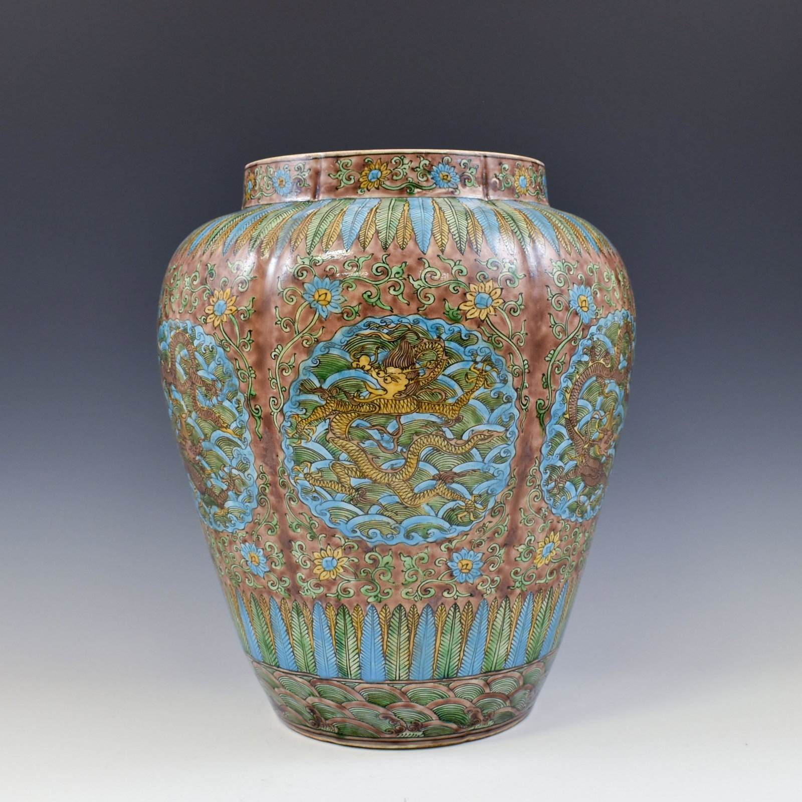 MING JIAJING SANCAIDRAGON PORCELAIN JAR: Chinese Ming Dynasty Period, Jiajing sancai dragon motif porcelain jar. The porcelain potted in jar shape, having large and thick potted body, sturdily potted in a bulbous body, ovoid belly, heavy on 