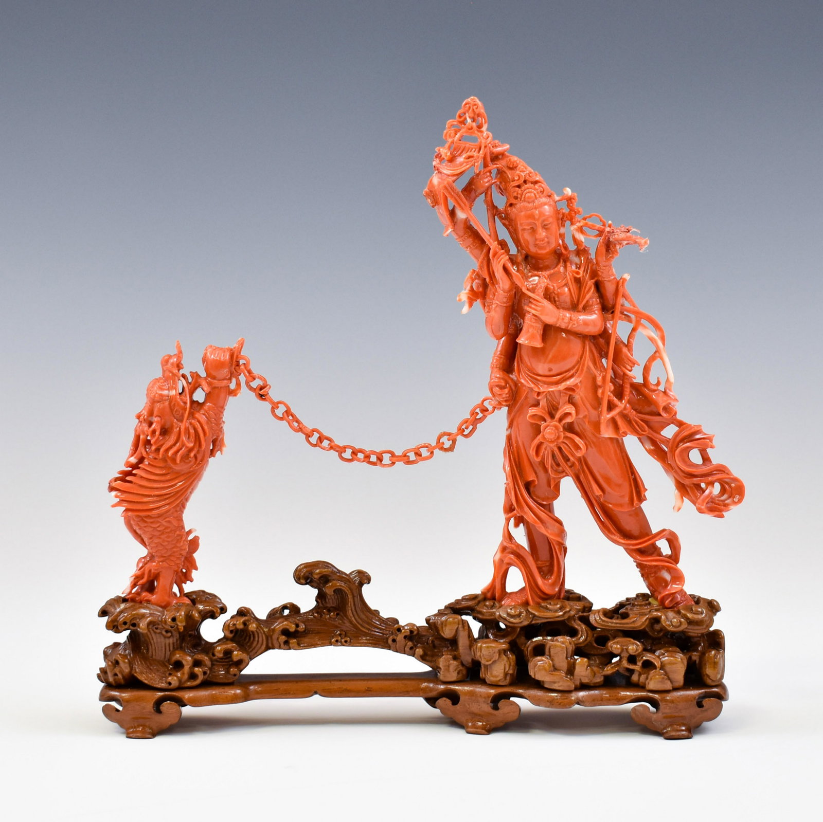 RED CORAL CARVING ON STAND: Chinese Red coral carving statue of immortanl and attendant on stand. Dimensions: Largest Coral 8.25" W x 4" W