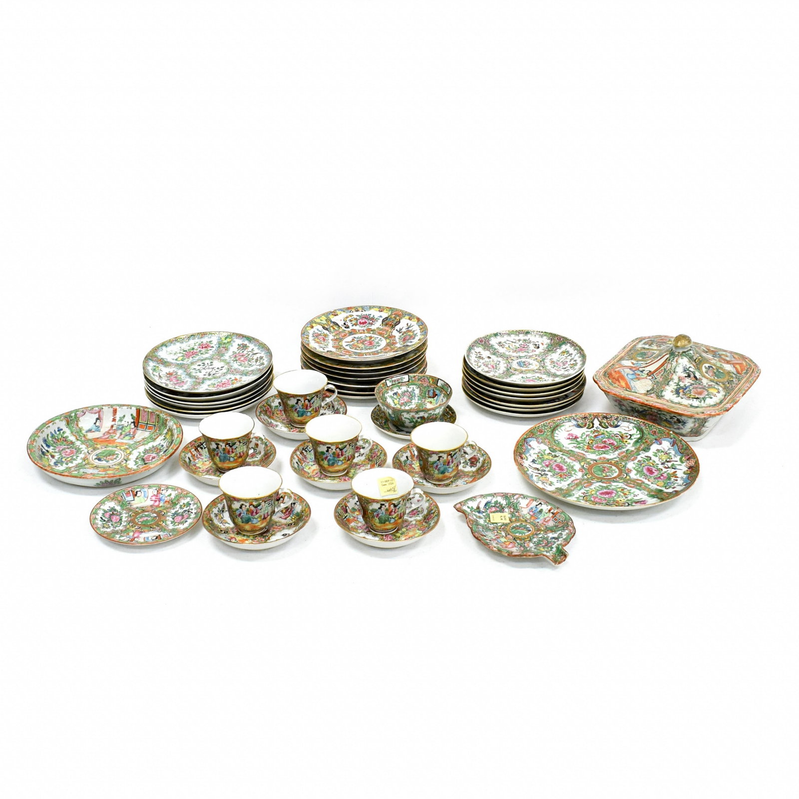 A GROUP OF CHINESE EXPORT SETS: A GROUP OF CHINESE EXPORT 'CANTON FAMILLE ROSE' PORCELAIN TABLEWARES, 19TH CENTURY, CHRISTIE'S SALE 2335 New York 2010 in various patterns comprising a vegetable dish and cover, a saucer dish, a leaf-