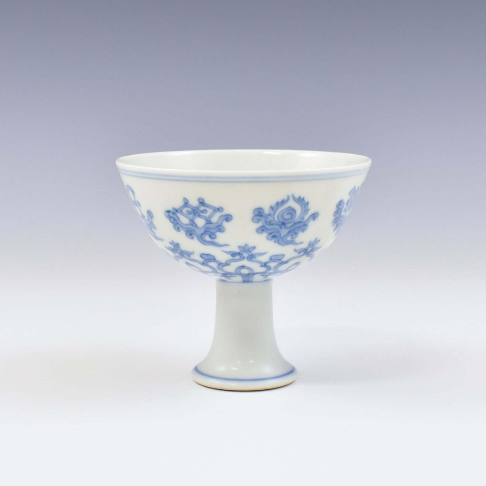 MING CHENGHUA BLUE & WHITE LOTUS POND HIGH BOWL: Chinese Ming Dynasty Period Chenghua blue and white Bajixiang motif porcelain high bowl. The porcelain potted with a shallow body, of a shallow vessel, broad wide cavetto, with a flaring opening upper