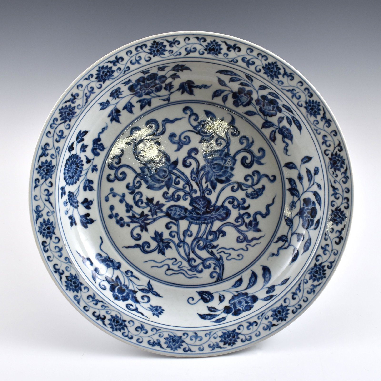 Ming Blue & white floral banquet Charger: Dimensions: 2-3/4" H x 15-3/8" Dia PROVENANCE: From Private estate collections of David Frederick Boyd, of Marietta, Georgia (1935 - 2018). Served in the United States Army, thereafter, employed by a 