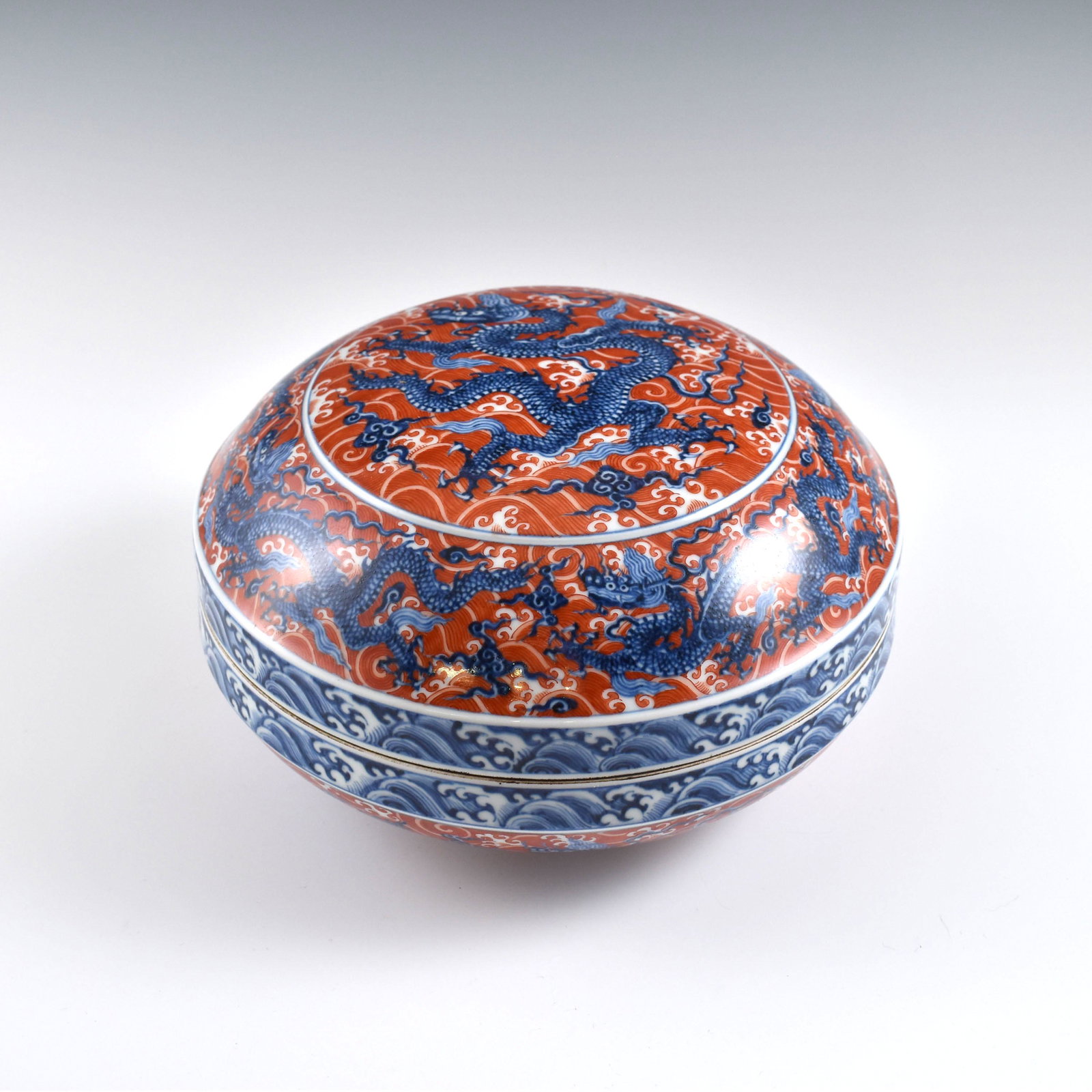 Ming red & blue dragon lidded round box: Dimensions: 6-3/8" H x 10-1/2" Dia. Chinese Ming Dynasty Period, Red & blue dragon lidded round box. Potted in a slightly flattened round box, with rounded wide cavetto, correspondence dome lid, raise