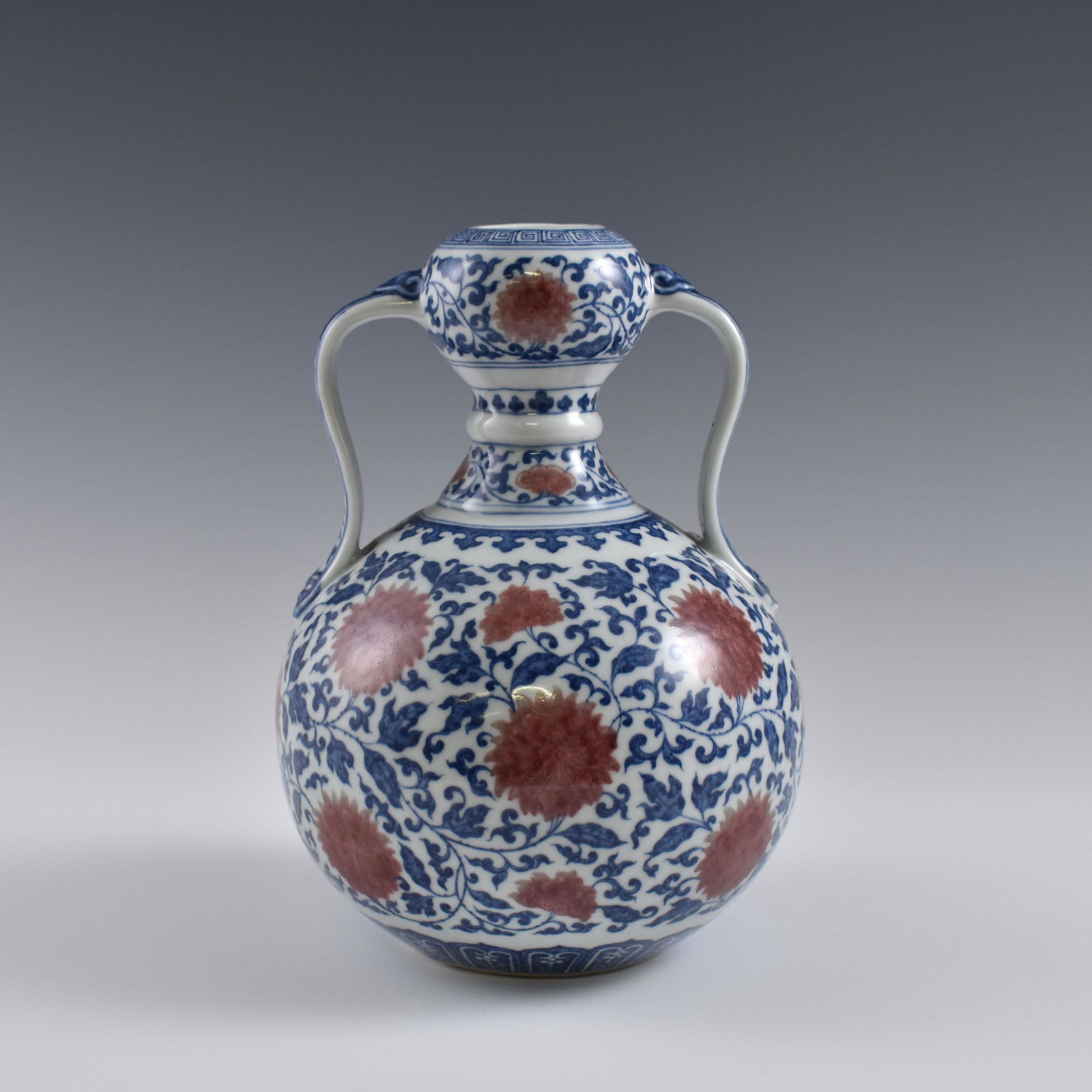 Yongzheng Red & Blue Wrapped floral amphora garlic vase: Dimensions: 8-7/8" H x 6-1/8" W Chinese Qing Dynasty Period, Red & Blue Wrapped floral amphora garlic vase. Potted in garlic bottle vase, bulbous lower belly, thick, with rounded shoulder, short cylin