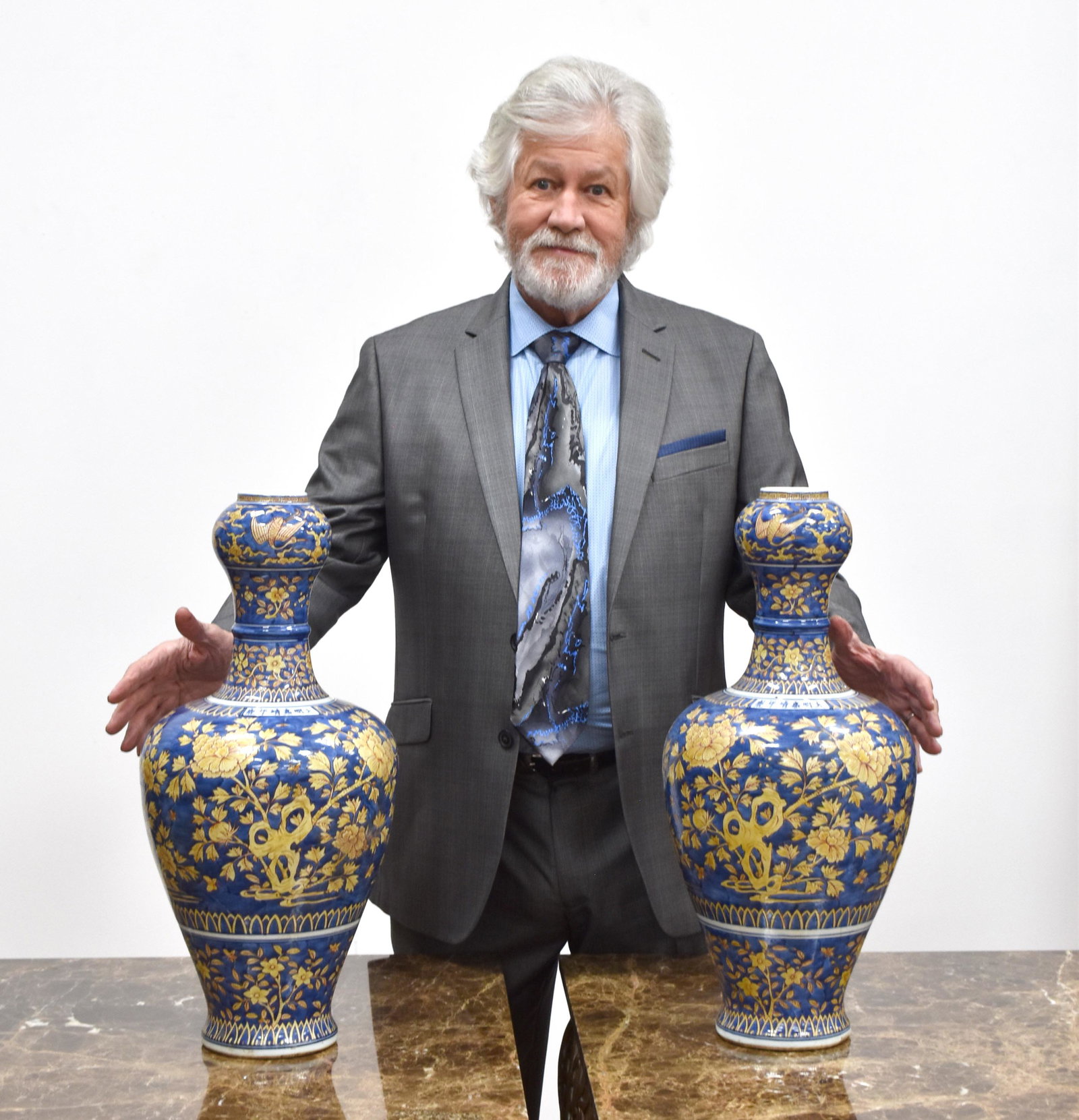 PAIR BLUE GLAZED FLORAL MOTIF GARLIC VASES: Dimensions (cm): Height: 53 Diameter: 24 Pair of Chinese Ming Dynasty Period Blue Glazed Floral Motif Garlic Vases. The porcelain potted in garlic bottle vase, large, tall and thick, bulbous lower bel
