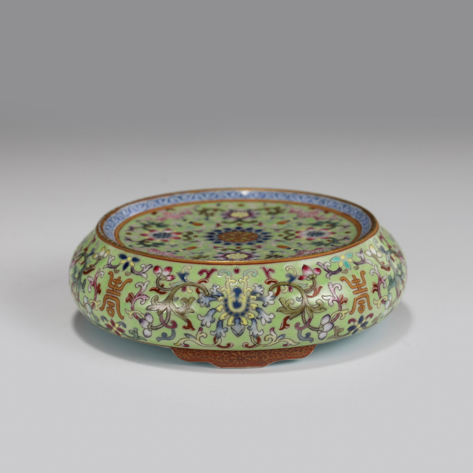 CHINESE FAMILLE ROSE PORCELAIN DRUM: Dimensions (cm): Diameter: 10 Height: 3 Chinese Qing Dynasty Period Famille Rose Porcelain Drum. Finely carved with circle thick body, decreased on the wide center, raised on short ruyi motif foot bas