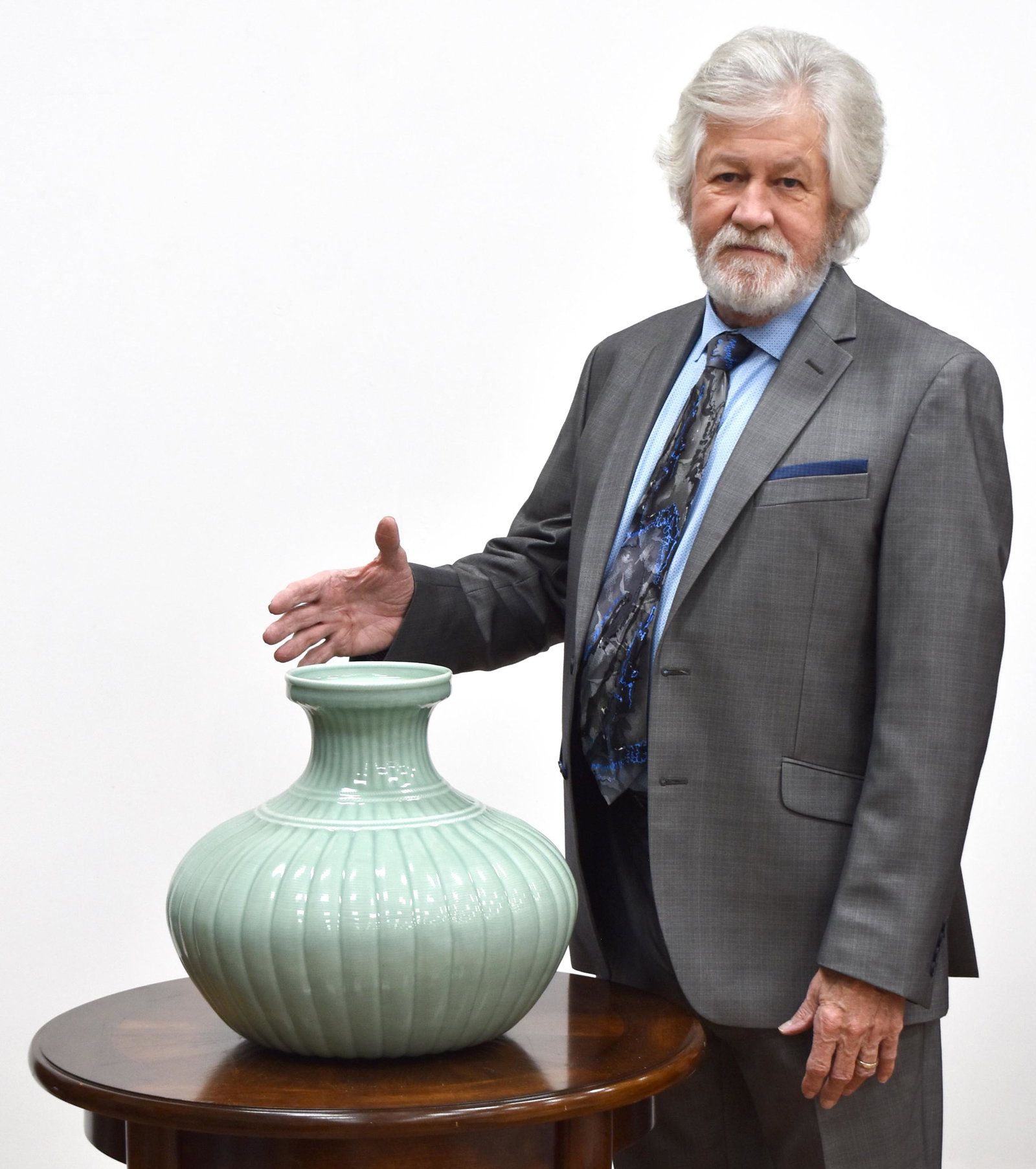 QING RIBBED BODY CELADON GLAZED JAR: PROVENANCE: From the Collections of Henry Windermere (1932- 2018) Covington, Georgia, served US Army for more than 28 years, retiring as a colonel. His received many military medals. He then became We
