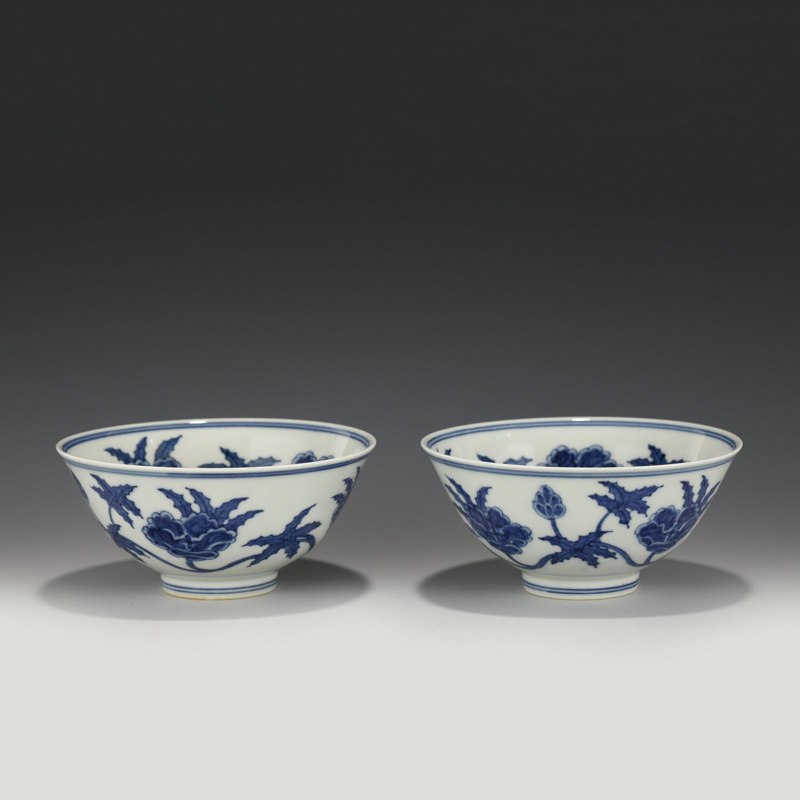 PAIR MING CHENGHUA BLUE & WHITE BOWLS: Dimensions: Height: 7 cm, Diam.: 14.5 cm Pair of Chinese Ming Dynasty Chenghua Blue & white Flowers Motif Porcelain Bowls. The bowls has an open mouth, rounded lip rim, thick, deep arced body, raised 