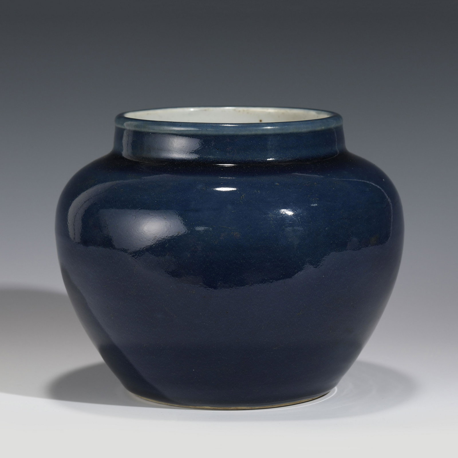 MING XUANDE COBALT BLUE PORCELAIN JAR: Dimensions: Height: 16.3 cm, Diam.: 19 cm Chinese Ming Dynasty Xuande Cobalt Blue Porcelain Jar. This porcelain has an round open mouth with a slightly out-turned lip, short thick neck leads to a conv