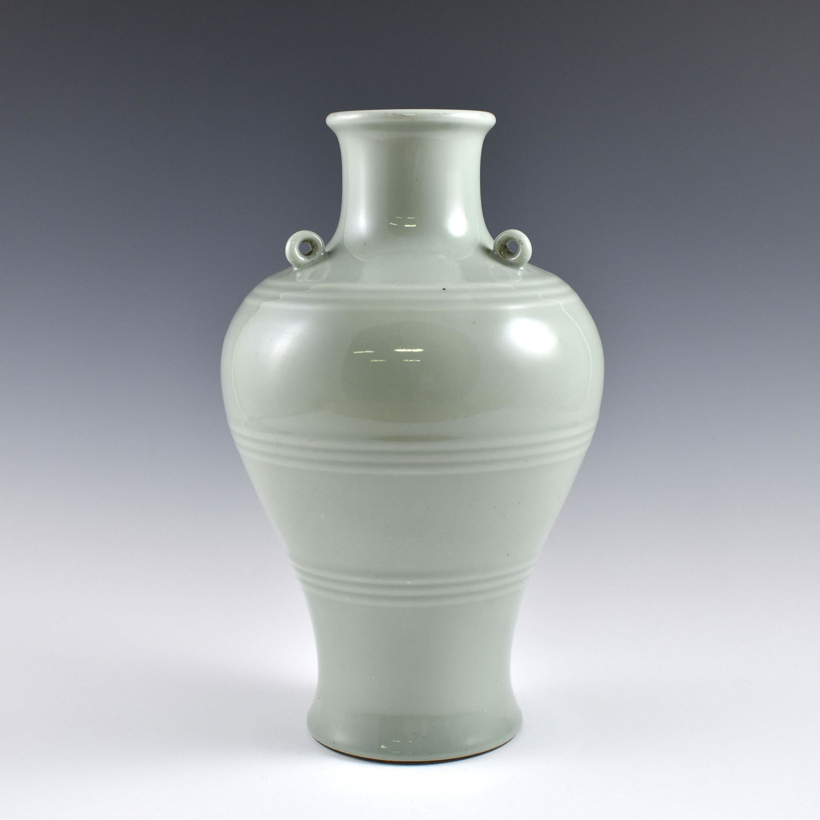 Qing douqing glazed amphora vase: Dimensions: 12-1/2" H x 7-1/2" Dia. Chinese Qing Dynasty Period, douqing glazed amphora vase. Potted in a amphora shaped vase, large, thick and tall, globular body, slighty oval lower body, rounded sh