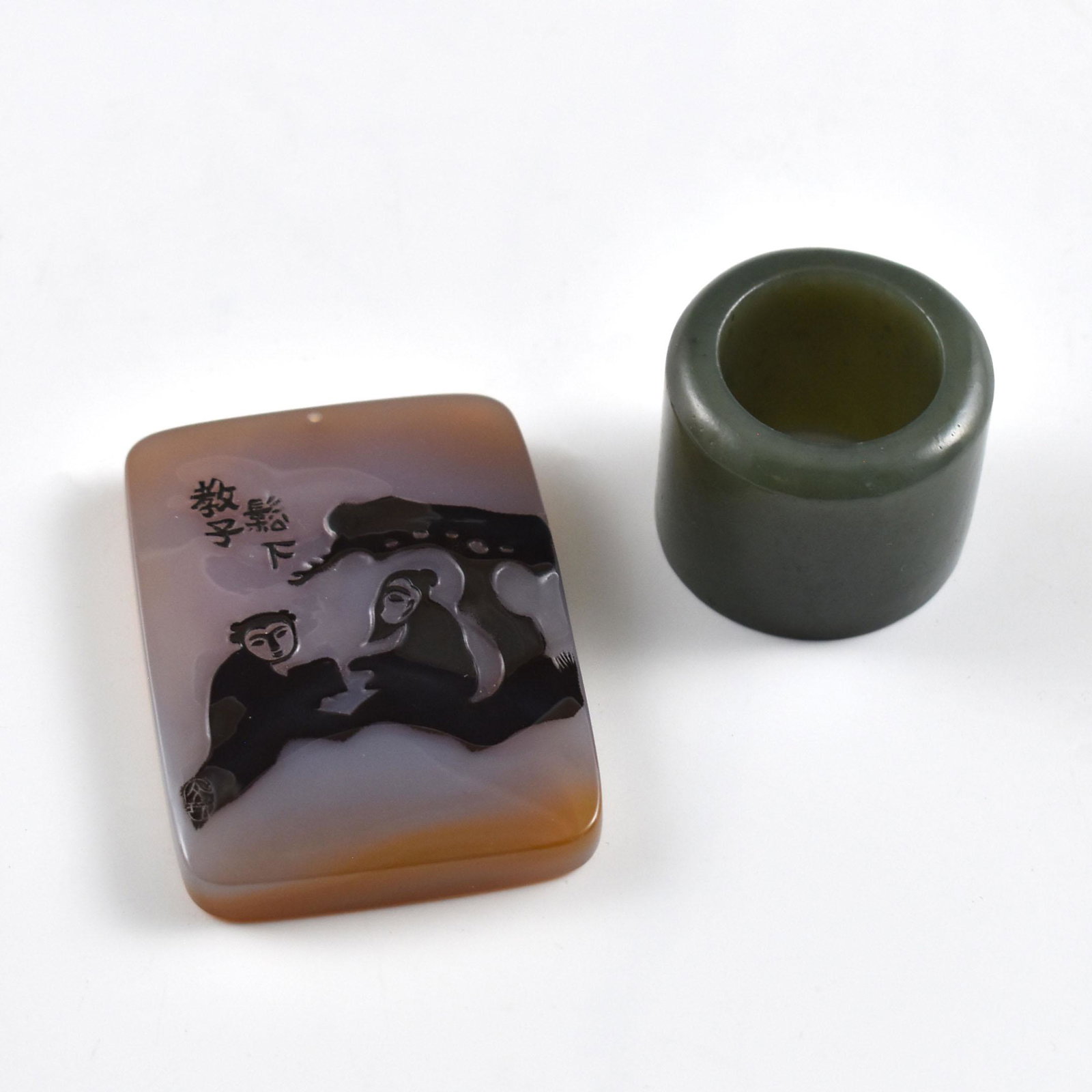 GREEN JADE BOLD RING AND AGATE CAMEO TILE: Dimensions: Largest in set 59.12mm H x 42.96mm W Weight: 50g Green jade bold ring and agate cameo tile