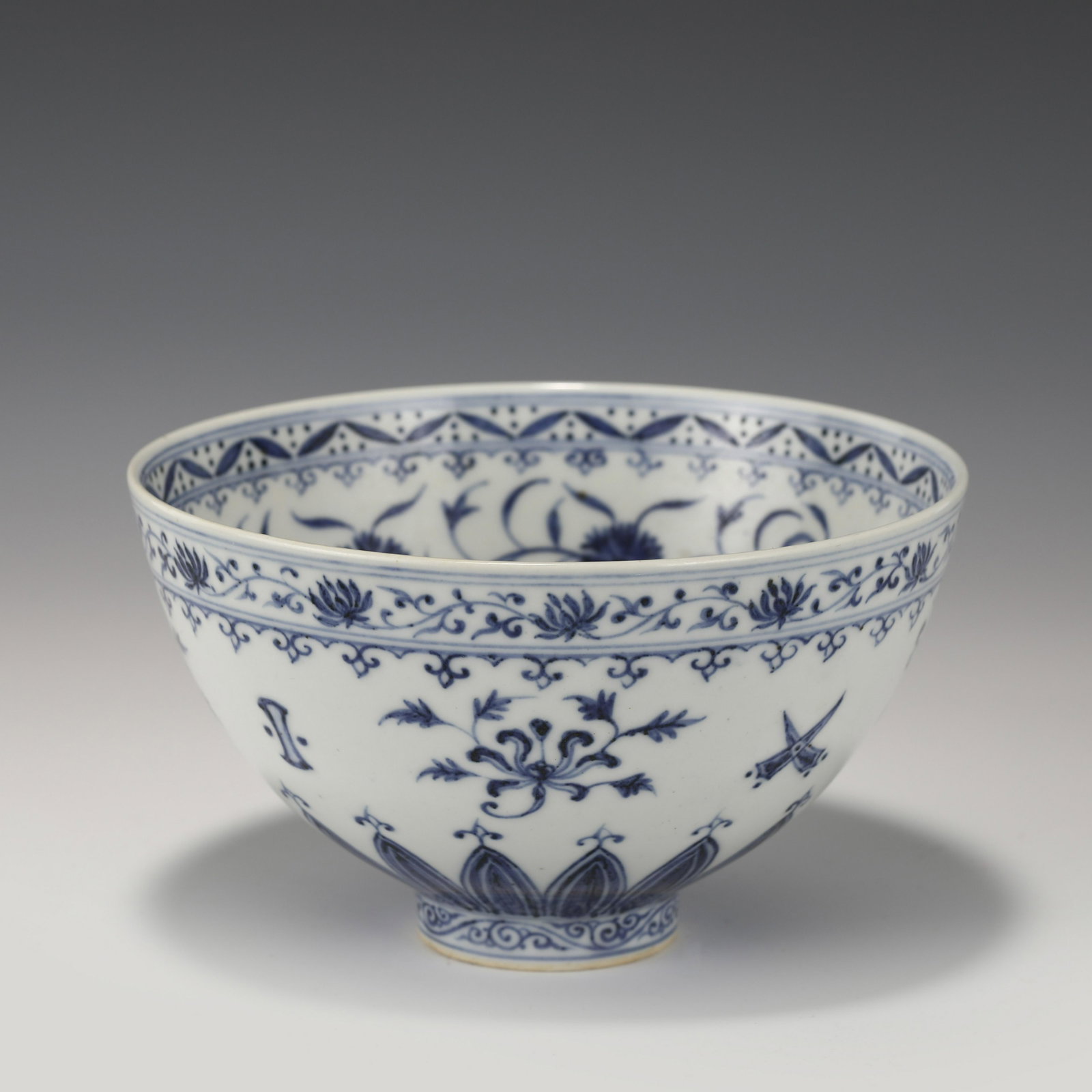 MING BLUE & WHITE BOWL: Dimensions: Width: 16cm, Height: 9cm Chinese Ming Dynasty Blue and White Flower Porcelain Bowl. The porcelain potted with a shallow body, slight deep, thick, flaring rim with angled cavetto elevated t