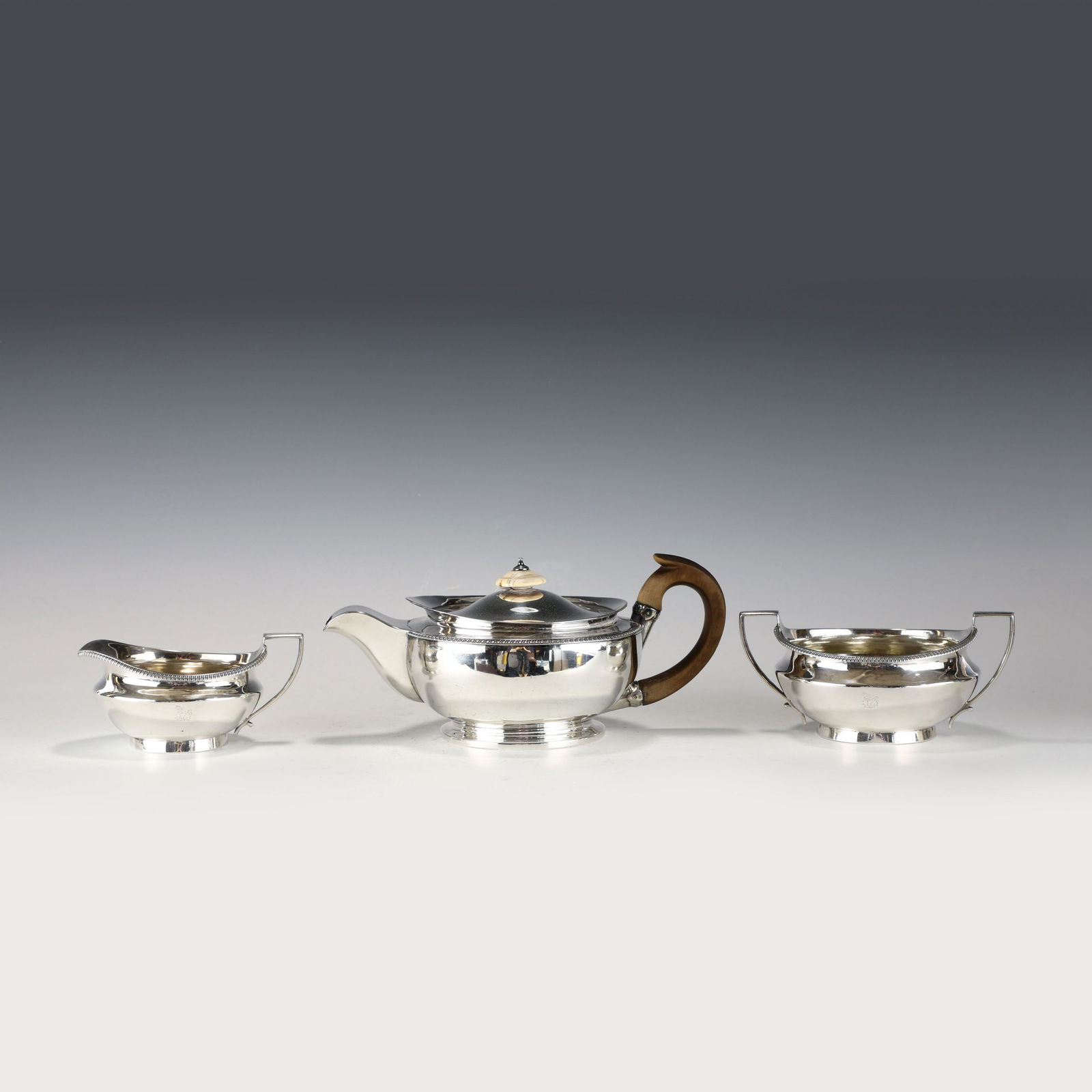 SET OF 3 PCS SILVER TEA SET: Dimensions: Height: 11 cm, Length: 24.5cm, Width: 15cm; Approximate Weight: 1046g (33.63 Troy Ounce) Set of 3 Pcs Silver tea set.