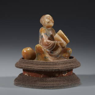 SHOUSHAN STONE CARVED ARHAT ON STAND: Dimensions: Length: 8cm, Width: 5cm, Height: 8.5 cm, Weigth: 197g Chinese Qing Dynasty Shoushan Stone Arhat Buddha On Fitted Cushion Hardwood Stand. This Porcelain statue of Buddha is perfect in