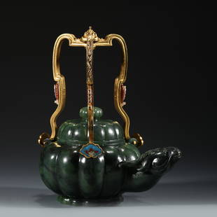 GREEN JADE SHEEP HEAD TEA POT: Dimensions: Length: 17.5cm, Width: 13.5cm, Height: 18.5cm Chinese Green Jade Sheep Head Tea Pot with gilt bronze handle. Fine green jade carved unto a tea pot shape, thick, pumpkin body, slight