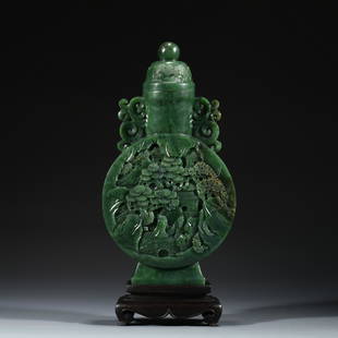 GREEN JADE MOUNTAIN LIDDED AMPHORA VASE ON STAND: Dimensions: Length: 12.5cm, Width: 4.5cm, Height: 24cm Chinese Green Jade Bottle Water On Carved Hardwood Stand. Finely green jade carved in bottle vase, the mid bulbous body tapered gracefully to